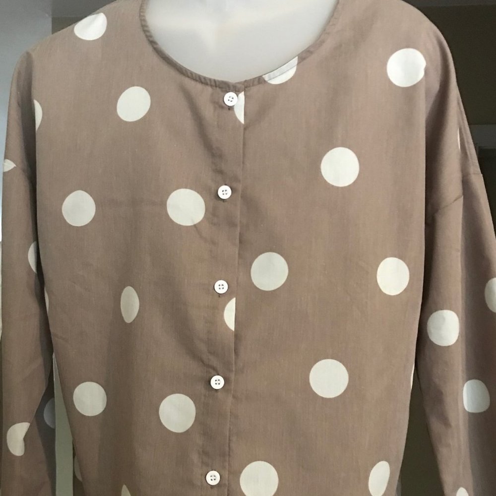 LIght, oversized blouse.  Women's M (would fit L)